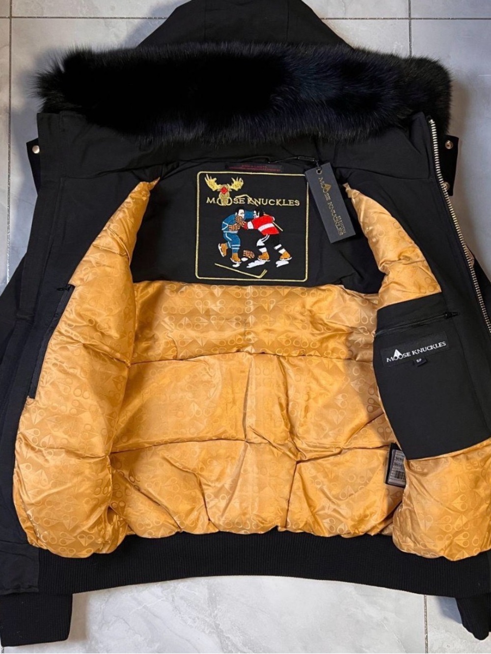 Moose Knuckles Men’s Black Parka with Gold Quilted Lining